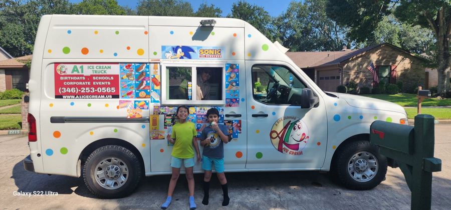 Two boys holding character ice cream bars from A1 truck