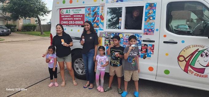 Families enjoying ice cream at the A1 Ice Cream truck at a Woodlands event